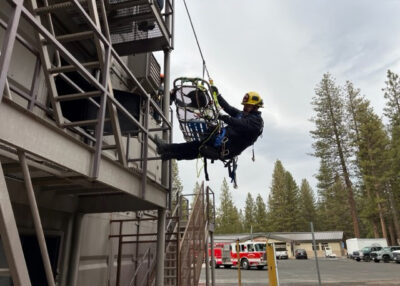 College of the Siskiyous Fire Program Student propelling off building